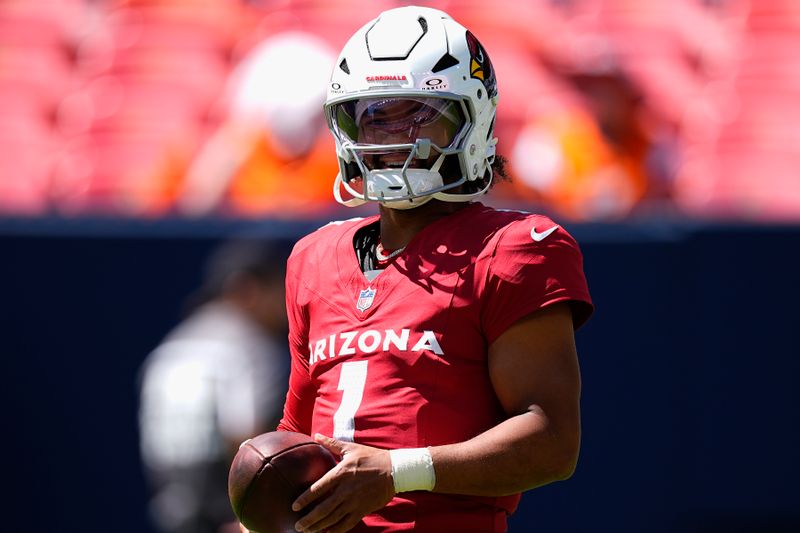 Arizona Cardinals quarterback Kyler Murray pauses while warming up prior to a preseason NFL football game against the Denver Broncos, Sunday, Aug. 25, 2024, in Denver. (AP Photo/David Zalubowski)