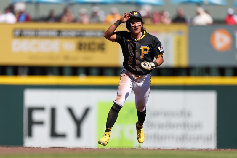 Mar 7, 2025; Bradenton, Florida, USA; Pittsburgh Pirates outfielder Ji Hwan Bae (3) looks to run past second base against the Philadelphia Phillies in the fifth inning during spring training at LECOM Park. Mandatory Credit: Nathan Ray Seebeck-Imagn Images
