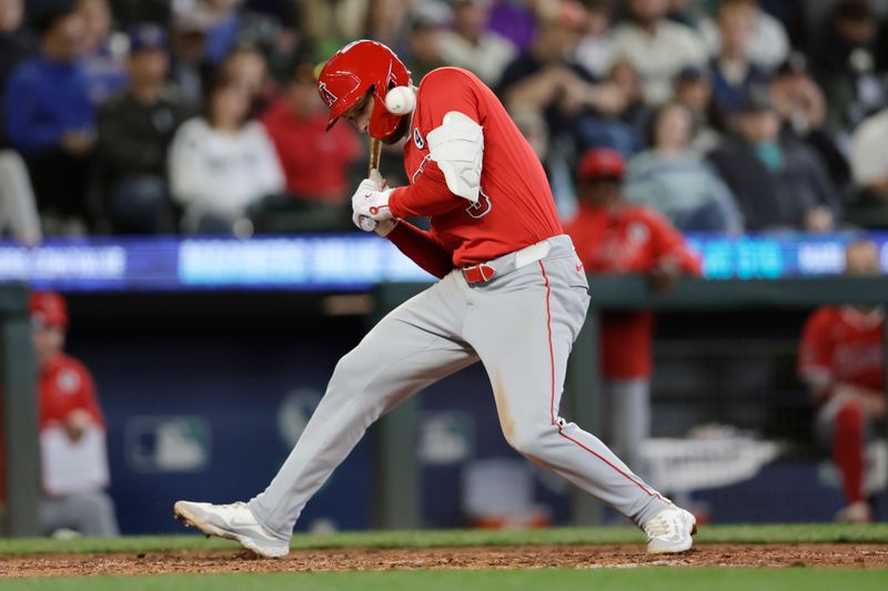 Jun 2, 2024; Seattle, Washington, USA; Los Angeles Angels designated hitter Taylor Ward (3) ducks from an inside pitch against the Seattle Mariners during the eighth inning at T-Mobile Park. Mandatory Credit: John Froschauer-USA TODAY Sports