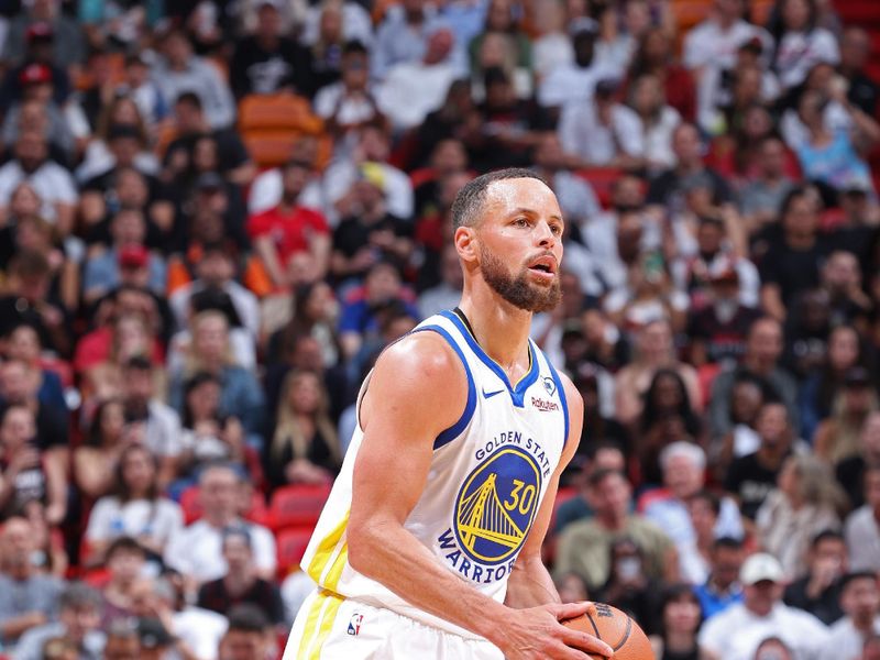 MIAMI, FL - MARCH 26: Stephen Curry #30 of the Golden State Warriors handles the ball during the game against the Miami Heat on March 26, 2024 at Kaseya Center in Miami, Florida. NOTE TO USER: User expressly acknowledges and agrees that, by downloading and or using this Photograph, user is consenting to the terms and conditions of the Getty Images License Agreement. Mandatory Copyright Notice: Copyright 2024 NBAE (Photo by Jeff Haynes/NBAE via Getty Images)