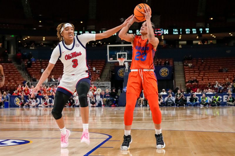 Mar 8, 2024; Greensville, SC, USA; Florida Gators guard Leilani Correa (23) shoots pressured by Ole Miss Rebels guard Kennedy Todd-Williams (3) during the second half at Bon Secours Wellness Arena. Mandatory Credit: Jim Dedmon-USA TODAY Sports