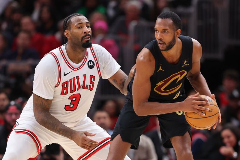 CHICAGO, ILLINOIS - FEBRUARY 28: Evan Mobley #4 of the Cleveland Cavaliers is defended by Andre Drummond #3 of the Chicago Bulls during the second half at the United Center on February 28, 2024 in Chicago, Illinois. NOTE TO USER: User expressly acknowledges and agrees that, by downloading and or using this photograph, User is consenting to the terms and conditions of the Getty Images License Agreement. (Photo by Michael Reaves/Getty Images)