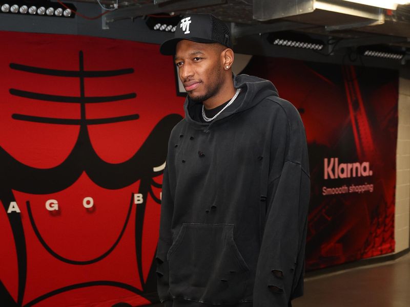 CHICAGO, ILLINOIS - OCTOBER 19: Torrey Craig #13 of the Chicago Bulls arrives prior to the preseason game against the Minnesota Timberwolves at the United Center on October 19, 2023 in Chicago, Illinois. NOTE TO USER: User expressly acknowledges and agrees that, by downloading and or using this photograph, User is consenting to the terms and conditions of the Getty Images License Agreement.  (Photo by Michael Reaves/Getty Images)