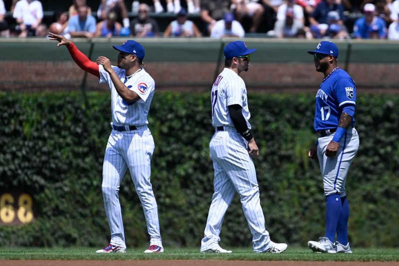 Aug 20, 2023; Chicago, Illinois, USA;  Chicago Cubs second baseman Christopher Morel (5), left, and Chicago Cubs right fielder Seiya Suzuki (27) talk with Kansas City Royals right fielder Nelson Velazquez (17) before the teams game at Wrigley Field. Mandatory Credit: Matt Marton-USA TODAY Sports