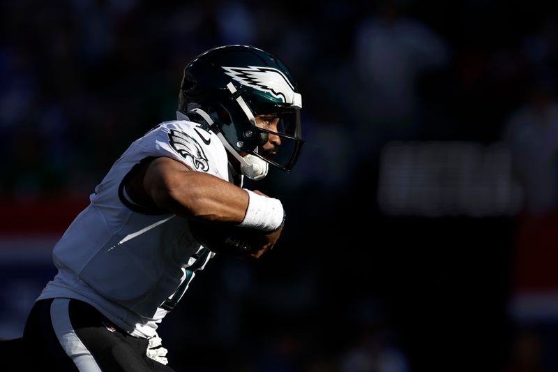 Philadelphia Eagles quarterback Jalen Hurts (1) runs with the ball during an NFL football game against the New York Giants Sunday, Oct. 20, 2024, in East Rutherford, N.J. (AP Photo/Adam Hunger)