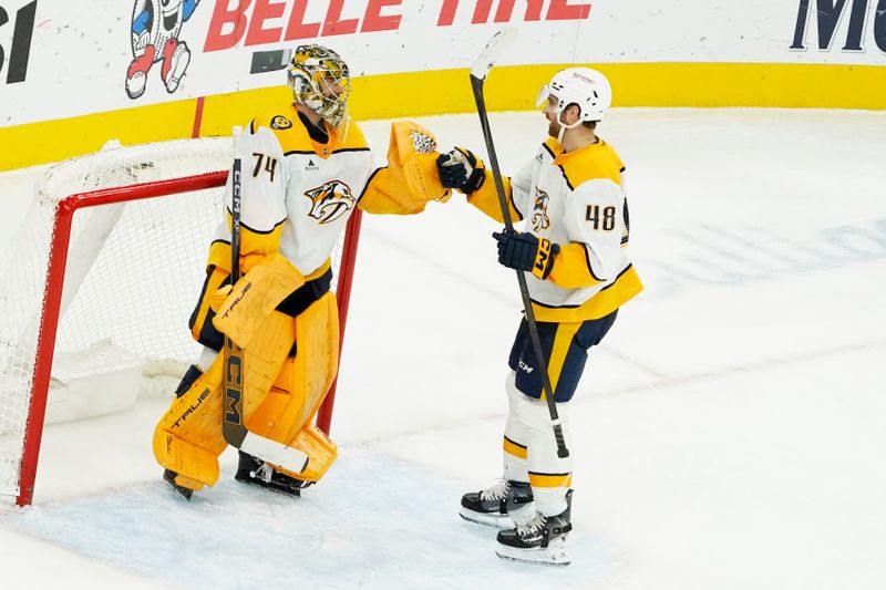 Nov 28, 2025; Chicago, Illinois, USA; Nashville Predators goaltender Juuse Saros (74) and defenseman Nick Perbix (48) celebrate the win against the Chicago Blackhawks at United Center. Mandatory Credit: David Banks-Imagn Images