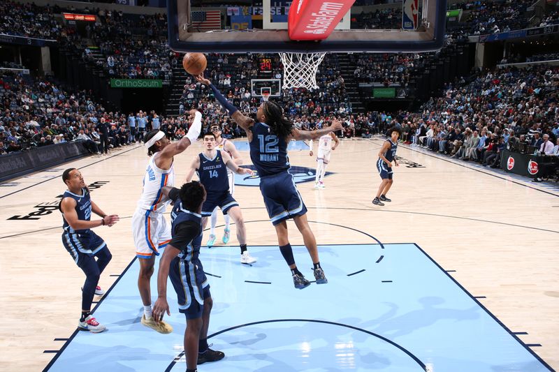 MEMPHIS, TN - MARCH 5:  Ja Morant #12 of the Memphis Grizzlies rebounds the ball during the game against the Oklahoma City Thunder on March 5, 2025 at FedExForum in Memphis, Tennessee. NOTE TO USER: User expressly acknowledges and agrees that, by downloading and or using this photograph, User is consenting to the terms and conditions of the Getty Images License Agreement. Mandatory Copyright Notice: Copyright 2025 NBAE (Photo by Joe Murphy/NBAE via Getty Images)