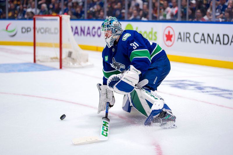 Apr 30, 2024; Vancouver, British Columbia, CAN; Vancouver Canucks goalie Arturs Silvos (31) handles the puck against the Nashville Predators during the second period in game five of the first round of the 2024 Stanley Cup Playoffs at Rogers Arena. Mandatory Credit: Bob Frid-USA TODAY Sports