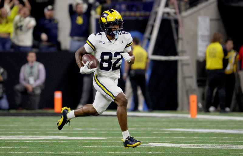 Dec 2, 2023; Indianapolis, IN, USA; Michigan Wolverines wide receiver Semaj Morgan (82) returns a punt during the first quarter of the Big Ten Championship game against the Iowa Hawkeyes at Lucas Oil Stadium. Mandatory Credit: Trevor Ruszkowski-USA TODAY Sports