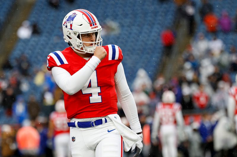 New England Patriots quarterback Bailey Zappe (4) prepares before an NFL football game against the Los Angeles Chargers on Sunday, Dec. 3, 2023, in Foxborough, Mass. (AP Photo/Greg M. Cooper)