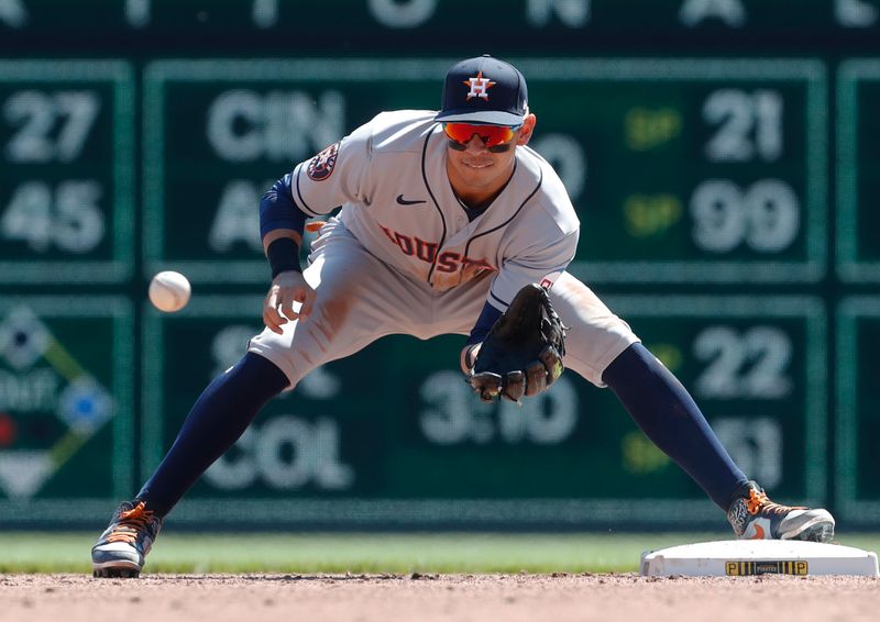 Apr 12, 2023; Pittsburgh, Pennsylvania, USA;  Houston Astros second baseman Mauricio Dubon (14) takes a throw at second base to begin a double play against the Pittsburgh Pirates during the fifth inning at PNC Park. Mandatory Credit: Charles LeClaire-USA TODAY Sports