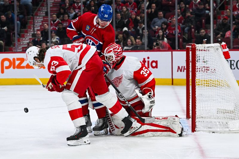 Dec 2, 2023; Montreal, Quebec, CAN; Detroit Red Wings goalie Ville Husso (35) blocks a shot deviation from Montreal Canadiens left wing Juraj Slafkovsky (20) during the third period at Bell Centre. Mandatory Credit: David Kirouac-USA TODAY Sports