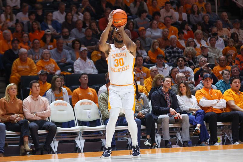 Feb 25, 2023; Knoxville, Tennessee, USA; Tennessee Volunteers guard Josiah-Jordan James (30) shoots a three pointer against the South Carolina Gamecocks during the first half at Thompson-Boling Arena. Mandatory Credit: Randy Sartin-USA TODAY Sports