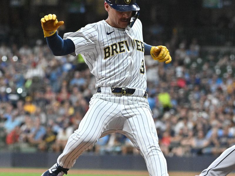 Sep 21, 2024; Milwaukee, Wisconsin, USA; Milwaukee Brewers third base Joey Ortiz (3) is called out at third base in a force out by Arizona Diamondbacks third base Eugenio Suárez (28) in the third inning at American Family Field. Mandatory Credit: Michael McLoone-Imagn Images