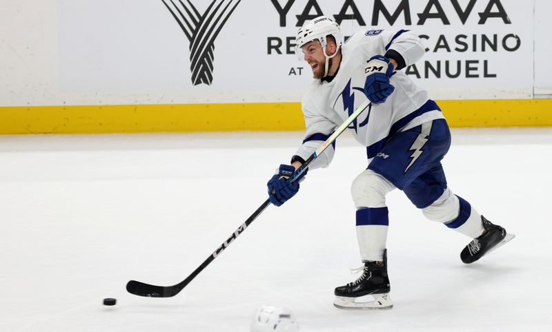 Mar 24, 2024; Anaheim, California, USA; Tampa Bay Lightning defenseman Erik Cernak (81) shoots during the third period against the Anaheim Ducks at Honda Center. Mandatory Credit: Jason Parkhurst-USA TODAY Sports