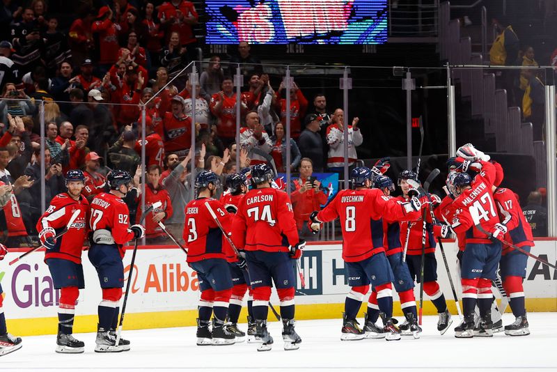 Oct 16, 2023; Washington, District of Columbia, USA; Washington Capitals goaltender Darcy Kuemper (35) celebrates with teammates after their game against the Calgary Flames at Capital One Arena. Mandatory Credit: Geoff Burke-USA TODAY Sports