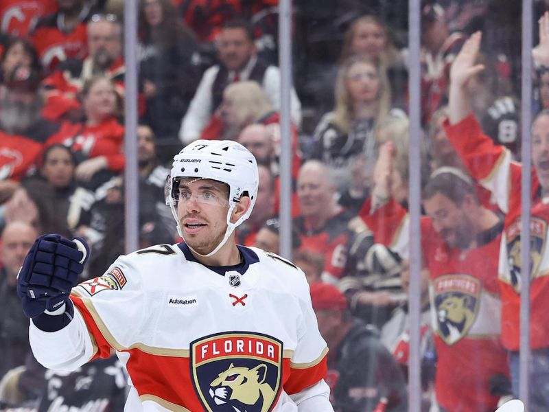 Oct 16, 2025; Newark, New Jersey, USA; Florida Panthers center Evan Rodrigues (17) celebrates his goal against the New Jersey Devils during the first period at Prudential Center. Mandatory Credit: Ed Mulholland-Imagn Images