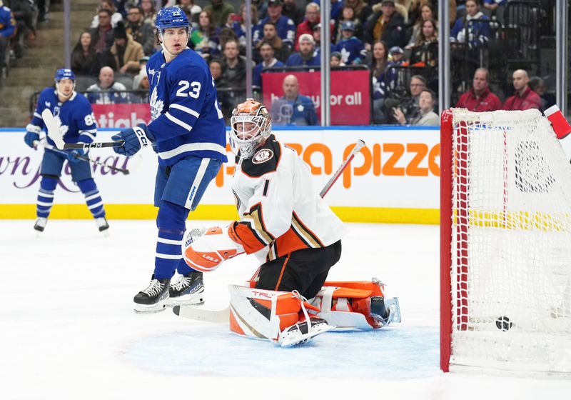 Feb 17, 2024; Toronto, Ontario, CAN; Anaheim Ducks goaltender Lukas Dostal (1) and Toronto Maple Leafs left wing Matthew Knies (23) watch as the puck goes into the net for a goal during the first period at Scotiabank Arena. Mandatory Credit: Nick Turchiaro-USA TODAY Sports