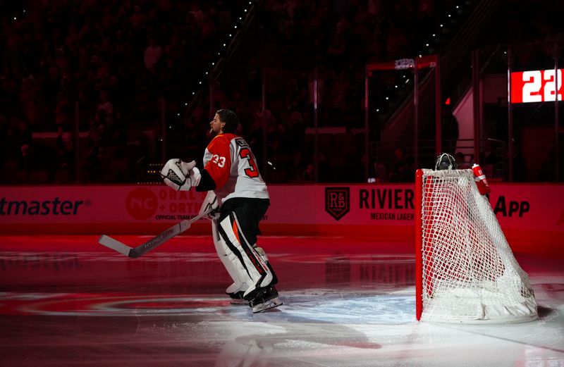 Mar 21, 2024; Raleigh, North Carolina, USA; Philadelphia Flyers goaltender Samuel Ersson (33) looks on before the game against the Carolina Hurricanes at PNC Arena. Mandatory Credit: James Guillory-USA TODAY Sports