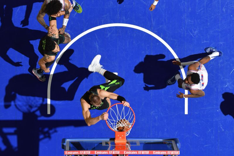 PHILADELPHIA, PA - FEBRUARY 2: Kristaps Porzingis #8 of the Boston Celtics dunks the ball during the game against the Philadelphia 76ers on February 2, 2025 at the Wells Fargo Center in Philadelphia, Pennsylvania NOTE TO USER: User expressly acknowledges and agrees that, by downloading and/or using this Photograph, user is consenting to the terms and conditions of the Getty Images License Agreement. Mandatory Copyright Notice: Copyright 2025 NBAE(Photo by Jesse D. Garrabrant/NBAE via Getty Images)