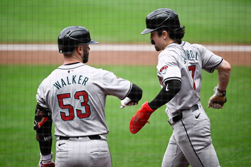 Jun 9, 2024; San Diego, California, USA;  Arizona Diamondbacks centerfielder Corbin Carroll (7), right, is congratulated by Christian Walker (53) after he scored during the second inning against the San Diego Padres at Petco Park. Mandatory Credit: Denis Poroy-USA TODAY Sports at Petco Park. 