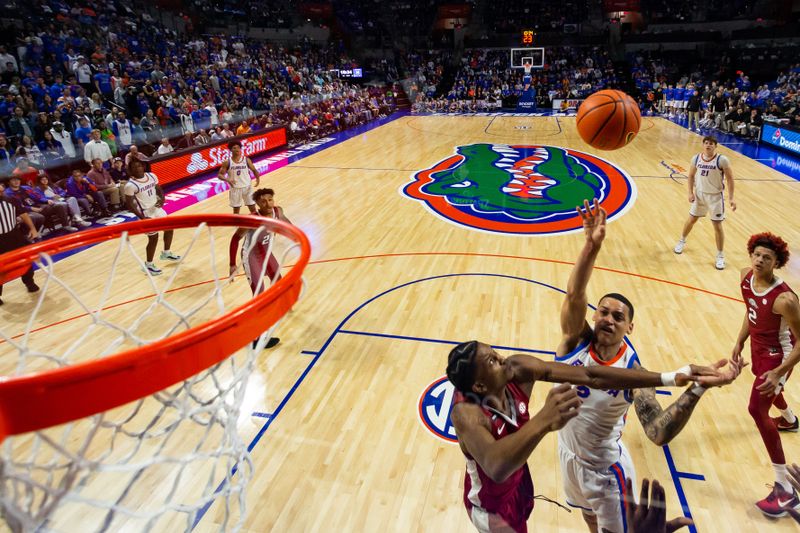 Jan 13, 2024; Gainesville, Florida, USA; Florida Gators guard Riley Kugel (2) shoots the ball over Arkansas Razorbacks guard Layden Blocker (6) during the first half at Exactech Arena at the Stephen C. O'Connell Center. Mandatory Credit: Matt Pendleton-USA TODAY Sports