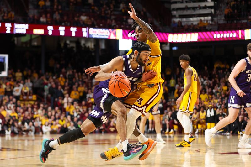 Feb 3, 2024; Minneapolis, Minnesota, USA; Northwestern Wildcats guard Boo Buie (0) works around Minnesota Golden Gophers guard Elijah Hawkins (0) during overtime at Williams Arena. Mandatory Credit: Matt Krohn-USA TODAY Sports