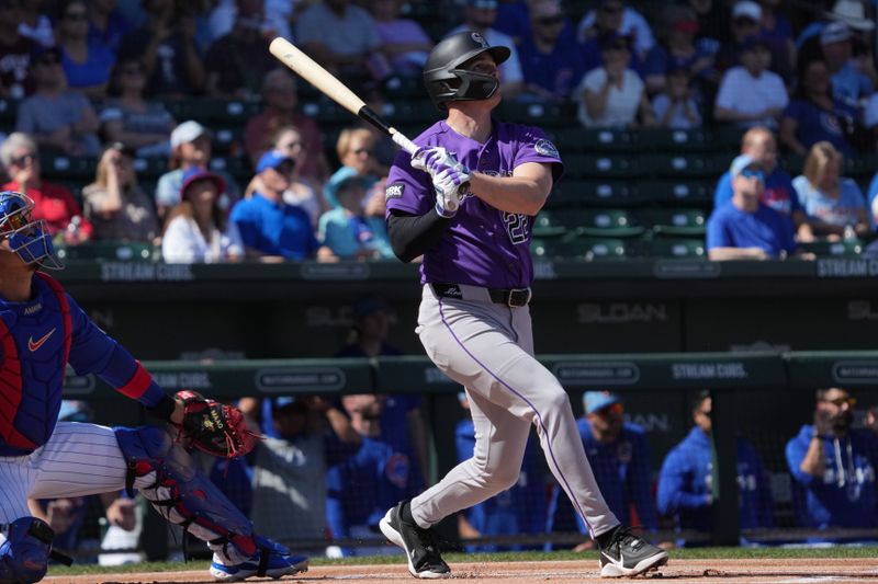 Feb 25, 2026; Mesa, Arizona, USA; Colorado Rockies right fielder Mickey Moniak (22) hits a solo home run against the Chicago Cubs in the first inning at Sloan Park. Mandatory Credit: Rick Scuteri-Imagn Images