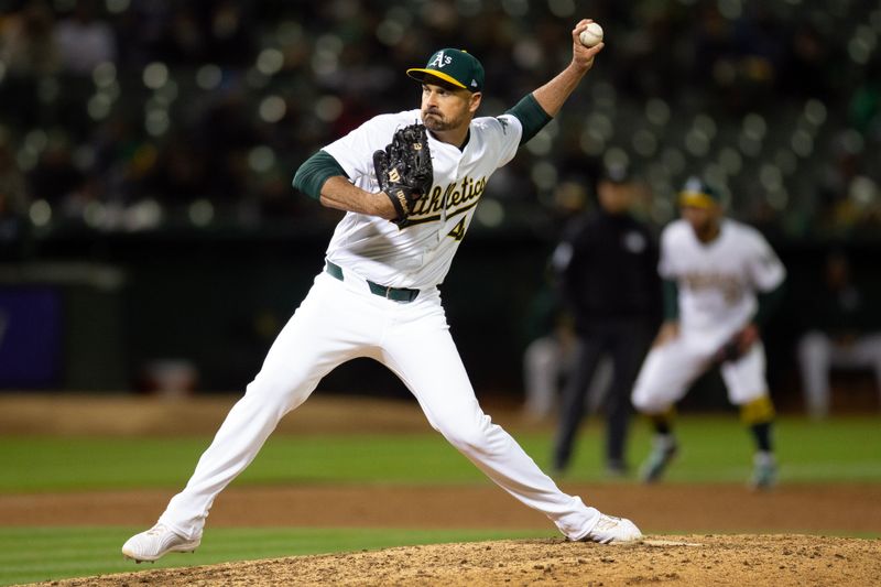 May 24, 2024; Oakland, California, USA; Oakland Athletics pitcher T.J. McFarland (48) delivers a pitch against the Houston Astros during the ninth inning at Oakland-Alameda County Coliseum. Mandatory Credit: D. Ross Cameron-USA TODAY Sports