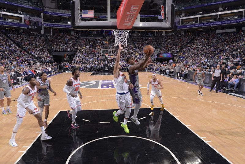 SACRAMENTO, CA - MARCH 9: Davion Mitchell #15 of the Sacramento Kings drives to the basket during the game against the New York Knicks on March 9, 2023 at Golden 1 Center in Sacramento, California. NOTE TO USER: User expressly acknowledges and agrees that, by downloading and or using this Photograph, user is consenting to the terms and conditions of the Getty Images License Agreement. Mandatory Copyright Notice: Copyright 2023 NBAE (Photo by Rocky Widner/NBAE via Getty Images)