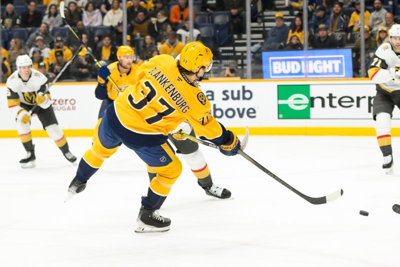 Jan 14, 2025; Nashville, Tennessee, USA;  Nashville Predators defenseman Nick Blankenburg (37) takes a shot on goal against the Vegas Golden Knights during the first period at Bridgestone Arena. Mandatory Credit: Steve Roberts-Imagn Images