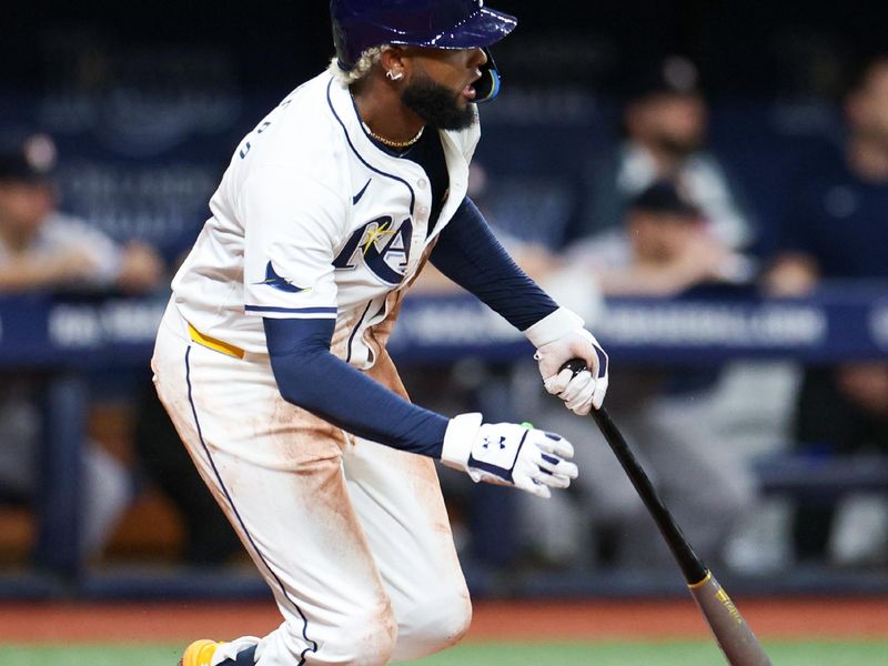 Aug 13, 2024; St. Petersburg, Florida, USA; Tampa Bay Rays third baseman Junior Caminero (13) singles against the Houston Astros in the fourth inning at Tropicana Field. Mandatory Credit: Nathan Ray Seebeck-USA TODAY Sports