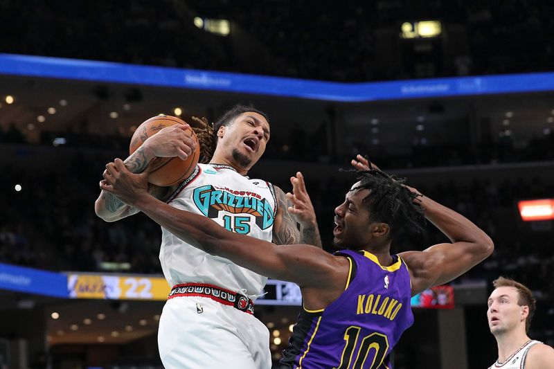 MEMPHIS, TENNESSEE - NOVEMBER 06: Brandon Clarke #15 of the Memphis Grizzlies and Christian Koloko #10 of the Los Angeles Lakers battle for a rebound during the first half at FedExForum on November 06, 2024 in Memphis, Tennessee. NOTE TO USER: User expressly acknowledges and agrees that, by downloading and or using this photograph, User is consenting to the terms and conditions of the Getty Images License Agreement. (Photo by Justin Ford/Getty Images)