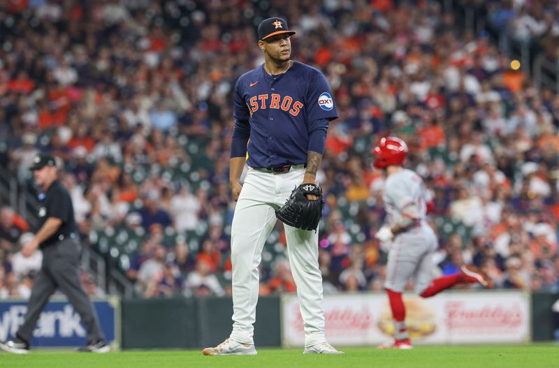 Sep 22, 2024; Houston, Texas, USA; Houston Astros relief pitcher Bryan Abreu (52) reacts and Los Angeles Angels shortstop Zach Neto (9) rounds the bases after hitting a home run during the eighth inning at Minute Maid Park. Mandatory Credit: Troy Taormina-Imagn Images