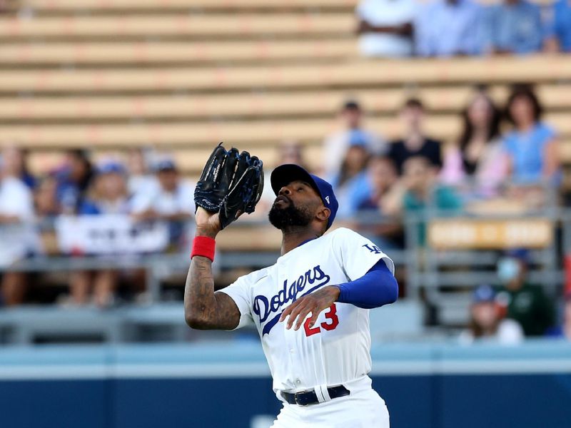 Jul 23, 2024; Los Angeles, California, USA; Los Angeles Dodgers outfielder Jason Heyward (23) makes a catch during the first inning against the San Francisco Giants at Dodger Stadium. Mandatory Credit: Jason Parkhurst-USA TODAY Sports