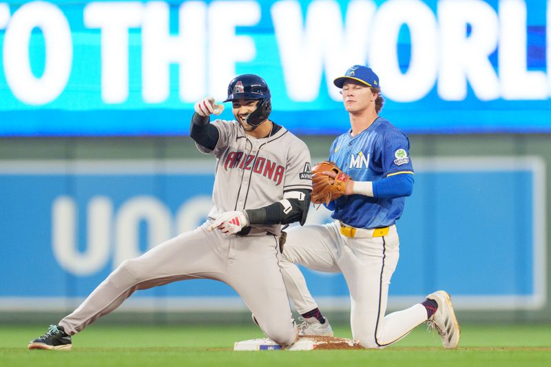 Sep 12, 2025; Minneapolis, Minnesota, USA; Arizona Diamondbacks designated hitter Jordan Lawlar (10) celebrates after hitting double off Minnesota Twins starting pitcher Pablo Lopez (49) in the second inning at Target Field. Mandatory Credit: Matt Blewett-Imagn Images