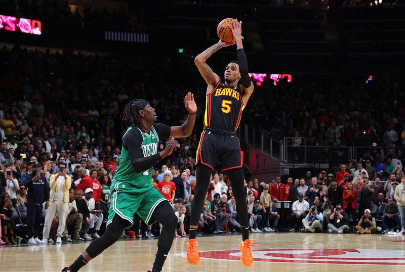 ATLANTA, GEORGIA - MARCH 28:  Dejounte Murray #5 of the Atlanta Hawks hits the game-winning basket against Jrue Holiday #4 of the Boston Celtics during overtime at State Farm Arena on March 28, 2024 in Atlanta, Georgia.  NOTE TO USER: User expressly acknowledges and agrees that, by downloading and/or using this photograph, user is consenting to the terms and conditions of the Getty Images License Agreement.  (Photo by Kevin C. Cox/Getty Images)