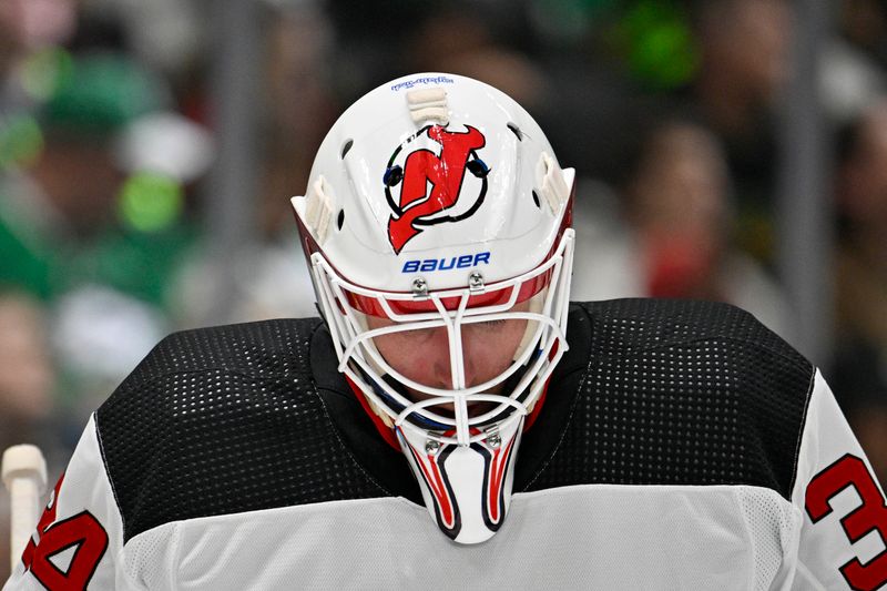 Mar 14, 2024; Dallas, Texas, USA; New Jersey Devils goaltender Jake Allen (34) prepares to face the Dallas Stars during the second period at the American Airlines Center. Mandatory Credit: Jerome Miron-USA TODAY Sports