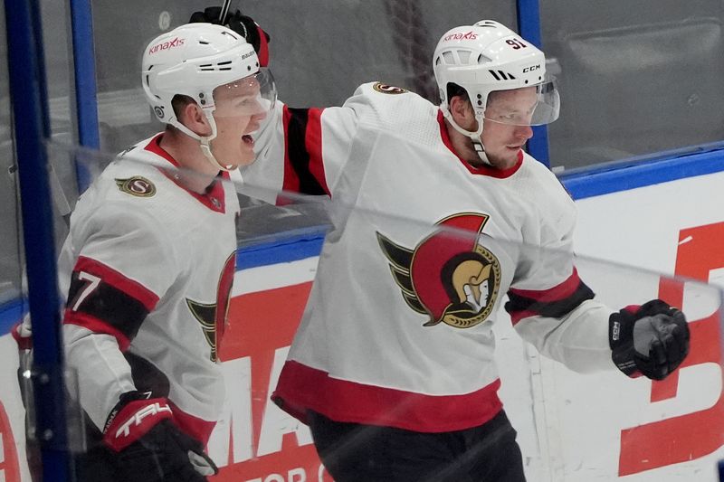 Feb 19, 2024; Tampa, Florida, USA; Ottawa Senators right wing Vladimir Tarasenko (91) is congratulated by left wing Brady Tkachuk (7) after scoring a goal against the Tampa Bay Lightning during the third period at Amalie Arena. Mandatory Credit: Dave Nelson-USA TODAY Sports