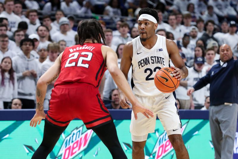 Feb 26, 2023; University Park, Pennsylvania, USA; Penn State Nittany Lions guard Jalen Pickett (22) dribbles the ball as Rutgers Scarlet Knights guard Caleb McConnell (22) defends during the first half at Bryce Jordan Center. Rutgers defeated Penn State 59-56. Mandatory Credit: Matthew OHaren-USA TODAY Sports