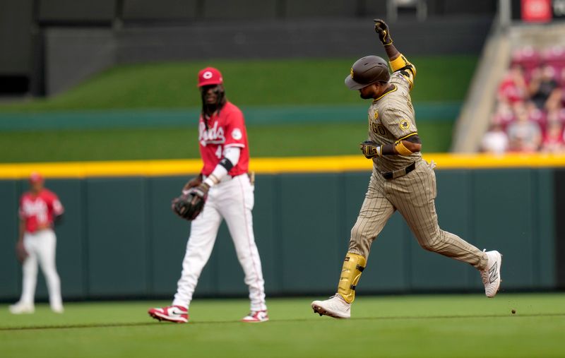 May 22, 2024; Cincinnati, Ohio, USA; San Diego Padres Luis Arraez (4) runs past Cincinnati Reds third baseman Elly De La Cruz (44) in the1st inning after hitting a home run at Great American Ball Park in Cincinnati. Mandatory Credit: Cara Owsley-USA TODAY Sports