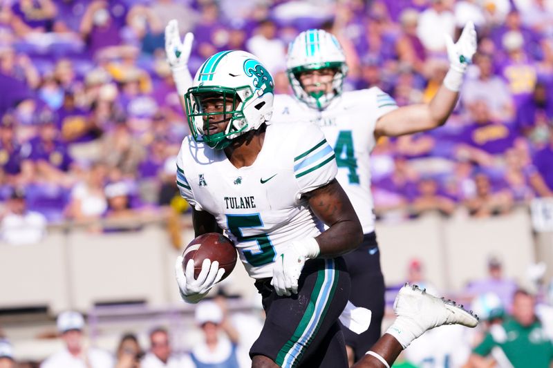 Oct 2, 2021; Greenville, North Carolina, USA;  Tulane Green Wave running back Ygenio Booker (5) scores on his touchdown run against the East Carolina Pirates during the first half at Dowdy-Ficklen Stadium. Mandatory Credit: James Guillory-USA TODAY Sports