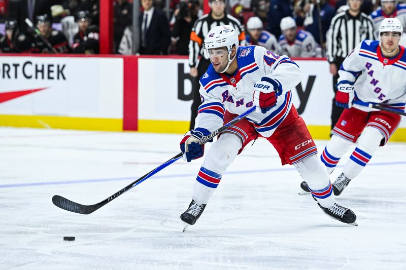 Dec 4, 2025; Ottawa, Ontario, CAN; New York Rangers center Noah Laba (42) passes the puck against the Ottawa Senators during the second period at Canadian Tire Centre. Mandatory Credit: David Kirouac-Imagn Images