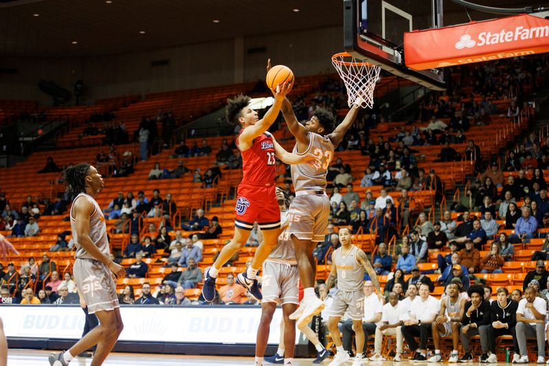 Feb 3, 2024; El Paso, Texas, USA; Liberty University Flames guard Joseph Venzant (23) tries to score against the UTEP Miners defense in the first half at Don Haskins Center. Mandatory Credit: Ivan Pierre Aguirre-USA TODAY Sports