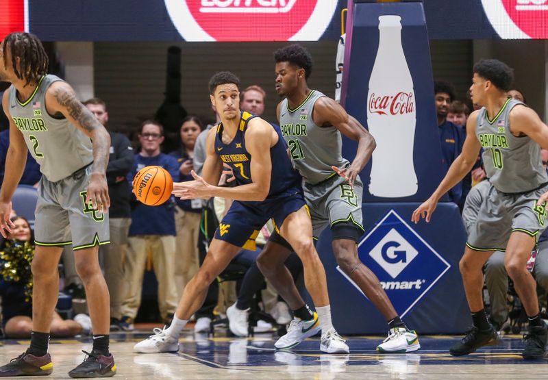 Feb 17, 2024; Morgantown, West Virginia, USA; West Virginia Mountaineers center Jesse Edwards (7) attempts to make a move against Baylor Bears center Yves Missi (21) during the first half at WVU Coliseum. Mandatory Credit: Ben Queen-USA TODAY Sports