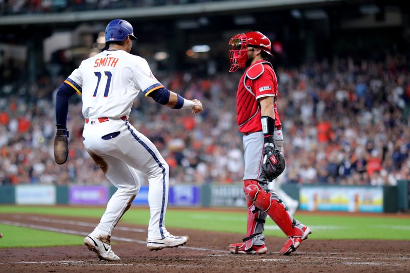 Sep 1, 2025; Houston, Texas, USA; Houston Astros right fielder Cam Smith (11) crosses home plate to score a run against the Los Angeles Angels during the sixth inning at Daikin Park. Mandatory Credit: Erik Williams-Imagn Images