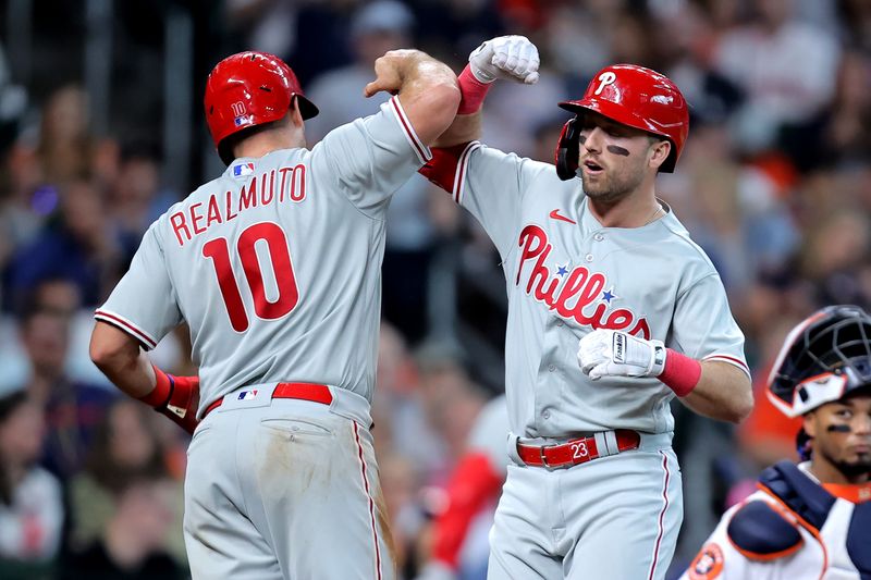 Apr 29, 2023; Houston, Texas, USA; Philadelphia Phillies first baseman Kody Clemens (23, right) is congratulated by catcher J.T. Realmuto (10) after hitting a two-run home run to right field against the Houston Astros during the sixth inning at Minute Maid Park. Mandatory Credit: Erik Williams-USA TODAY Sports