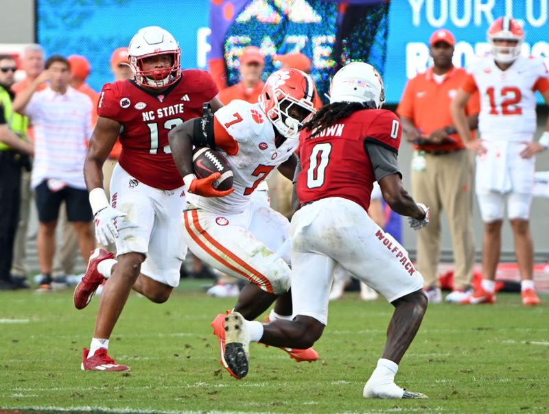 Oct 28, 2023; Raleigh, North Carolina, USA; Clemson Tigers running back Phil Mafah (7) runs the ball during the second half against the North Carolina State Wolfpack at Carter-Finley Stadium. Mandatory Credit: Rob Kinnan-USA TODAY Sports