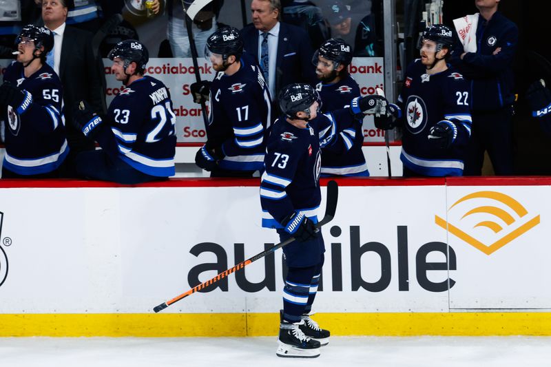 Apr 16, 2024; Winnipeg, Manitoba, CAN;  Winnipeg Jets forward Tyler T0ffoli (73) is congratulated by his teammates on his goal against the Seattle Kraken during the third period at Canada Life Centre. Mandatory Credit: Terrence Lee-USA TODAY Sports