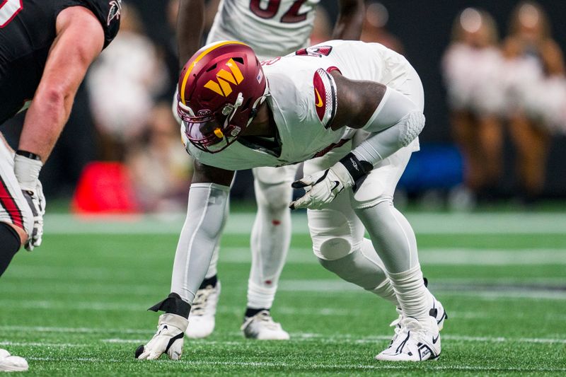 Washington Commanders defensive end Efe Obada (97) lines up during the first half of an NFL football game against the Atlanta Falcons, Sunday, Oct. 15, 2023, in Atlanta. The Washington Commanders won 24-16. (AP Photo/Danny Karnik)